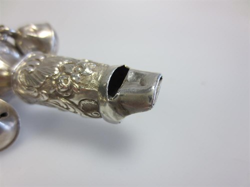 Lot 375 - A Victorian baby's silver whistle, rattle and teether
