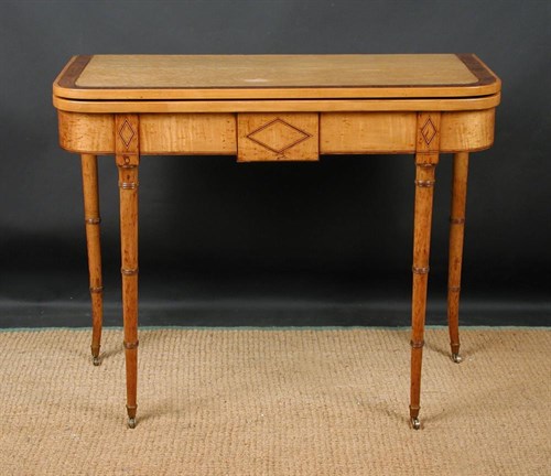 Lot 700 - A Regency maplewood card table, circa 1820