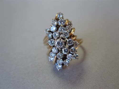 Lot 164 - An asymmetric diamond cluster ring