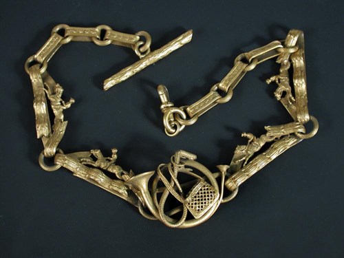 Lot 524 - A gilt metal fob chain with shaped links of...