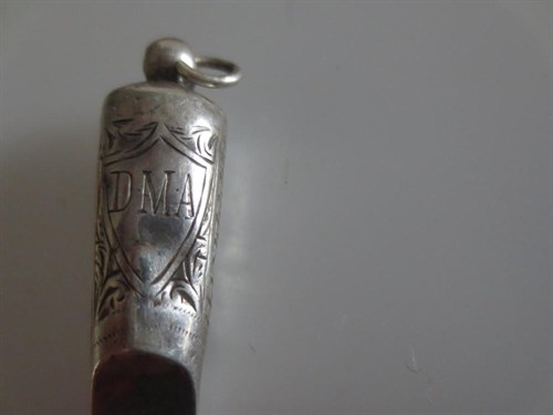 Lot 399 - A group of twelve miniature silver whistles