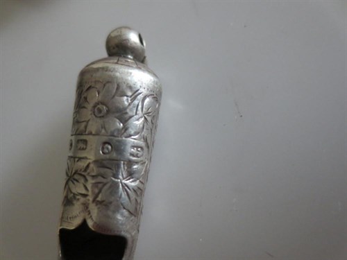 Lot 399 - A group of twelve miniature silver whistles