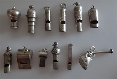 Lot 399 - A group of twelve miniature silver whistles