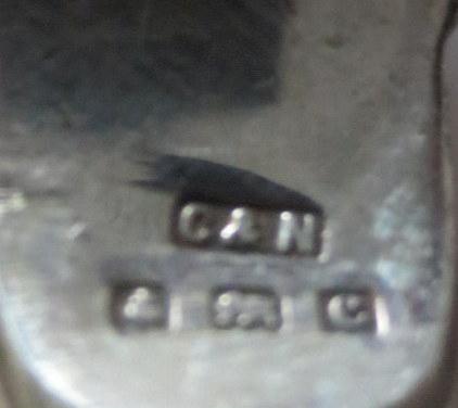 Lot 399 - A group of twelve miniature silver whistles