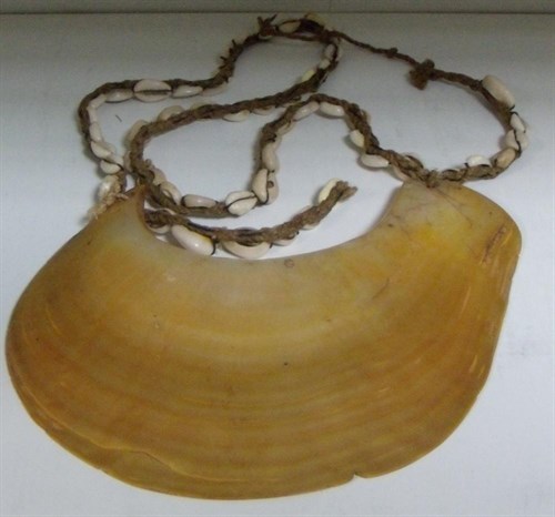 Lot 661 - A Malaita Dafi or mother of pearl and cowrie pectoral ornament