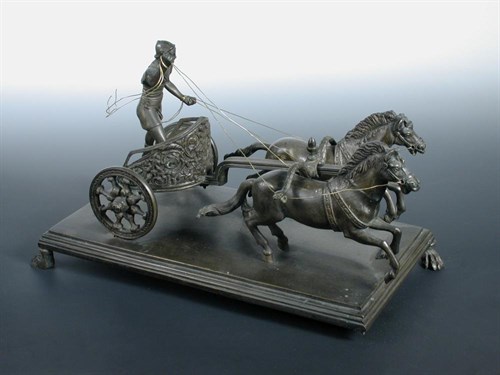 Lot 664 - A 19th century bronze model of a charioteer after the Antique