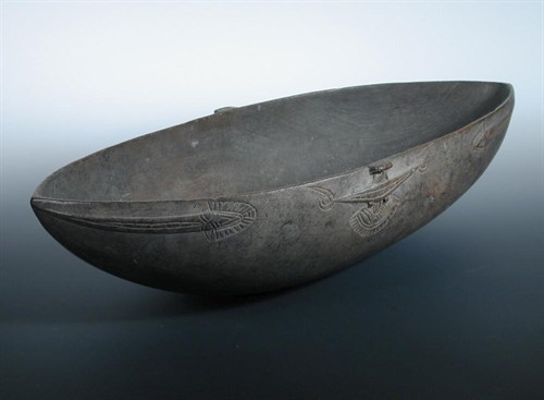 Lot 666 - A 19th century Tami island wood feast bowl
