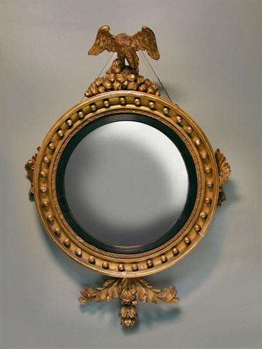 Lot 889 - A Regency gilt framed convex wall mirror