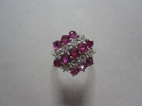 Lot 257 - A ruby, diamond and gold cluster ring