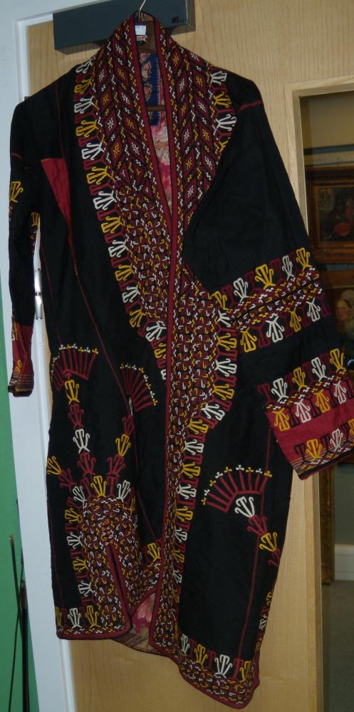 Lot 672 - A Persian black robe (shapan)
