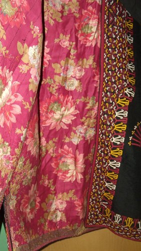 Lot 672 - A Persian black robe (shapan)