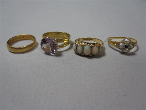 Lot 149 - A collection of four antique gold and gemset rings