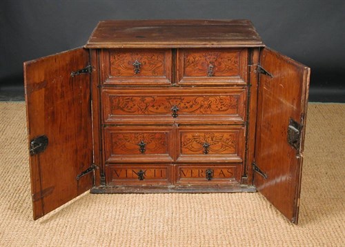 Lot 824 - An 18th century North Italian cyprus wood cabinet