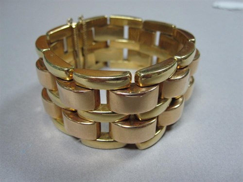 Lot 132 - A brick link cuff bracelet stamped '750, 18ct'