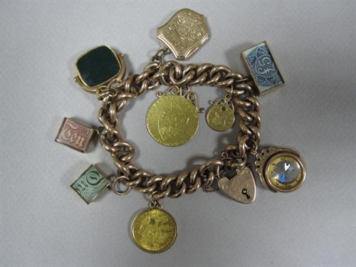 Lot 165 - A late 19th century 9ct rose gold bracelet with gold coins and other charms