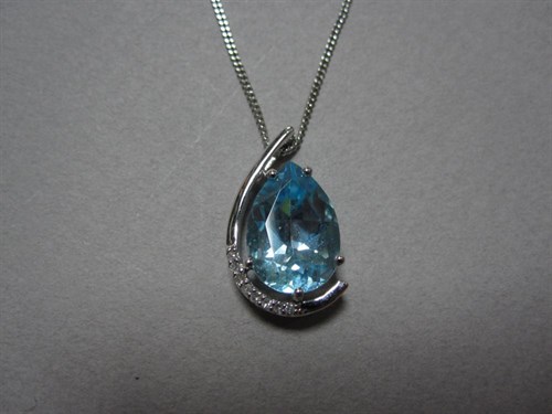 Lot 207 - A pear cut blue topaz and diamond pendant