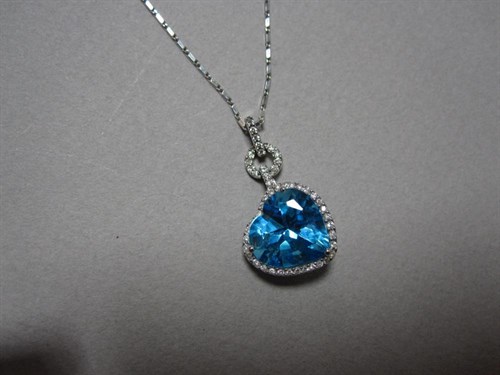 Lot 195 - A heart cut blue topaz and diamond pendant