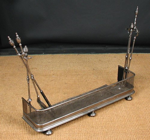 Lot 852 - A George III polished steel fire curb and stands