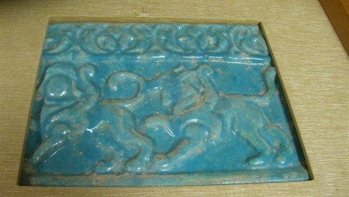 Lot 48 - A turquoise glazed relief moulded tile, possibly 12th century Kashan
