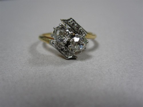 Lot 232 - A diamond two stone crossover ring
