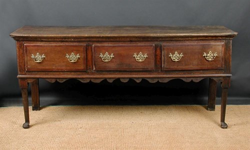Lot 827 - A George III oak dresser base, circa 1770