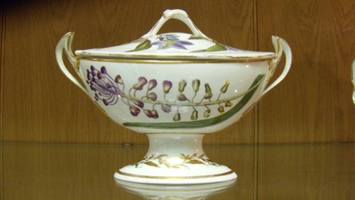 Lot 26 - A Duesbury Derby botanical sauce boat and cover