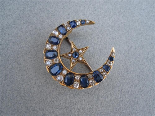Lot 180 - A sapphire and diamond crescent and star brooch