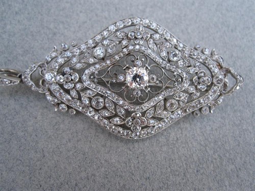 Lot 244 - A belle époque diamond pendant / brooch