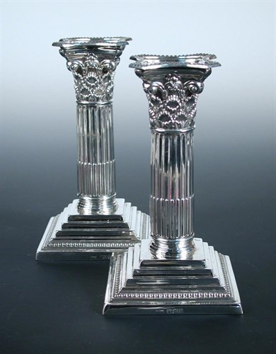 Lot 313 - A pair of late Victorian silver dwarf candlesticks