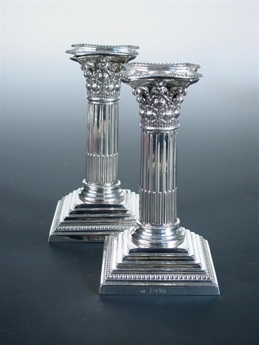 Lot 333 - A pair of late Victorian silver dwarf candlesticks