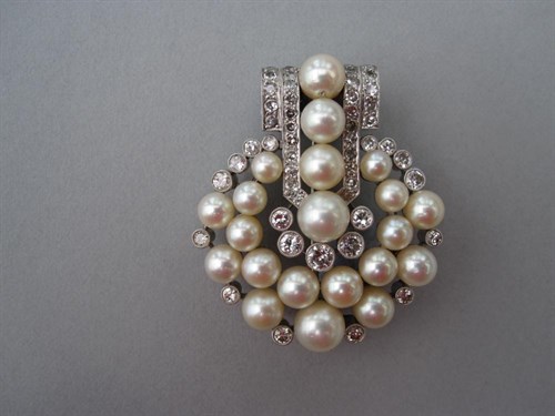 Lot 225 - A 1930's diamond and pearl brooch