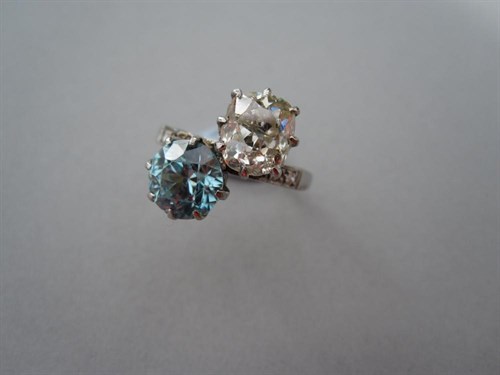 Lot 201 - A two-stone diamond and  blue zircon ring