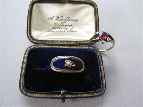 Lot 138 - A garnet and diamond ring together with a Georgian enamel and seed pearl lace pin