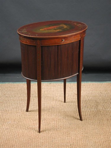 Lot 833 - An Edwardian mahogany oval sewing table