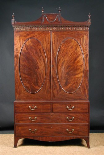 Lot 835 - A George III mahogany linen press,  circa 1790