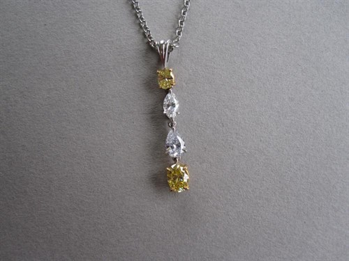 Lot 167 - A diamond and fancy yellow diamond pendant
