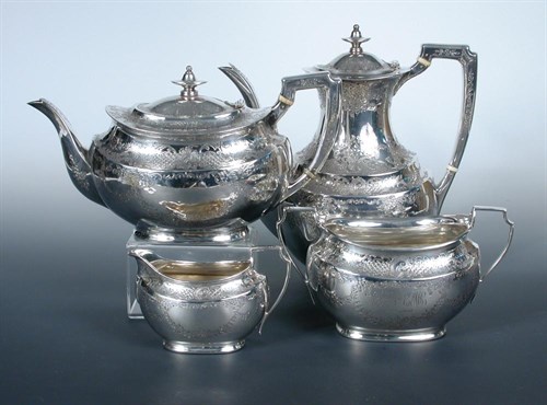 Lot 335 - A late Victorian/Edwardian silver four piece tea and coffee set