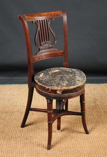 Lot 887 - A Regency mahogany music chair