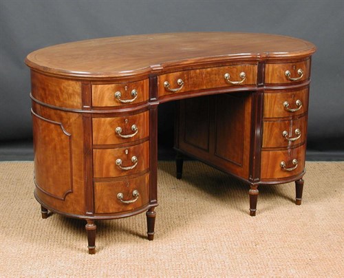 Lot 914 - An Edwardian mahogany kidney shaped kneehole desk, circa 1910