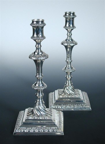 Lot 361 - A pair of George III cast silver candlesticks 