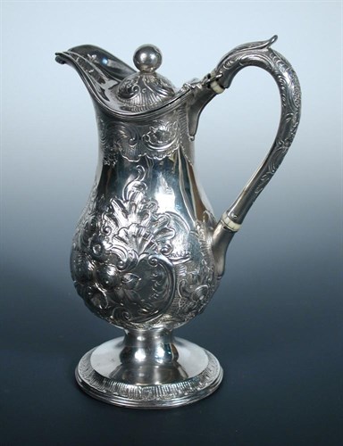 Lot 345 - A George III silver hotwater jug