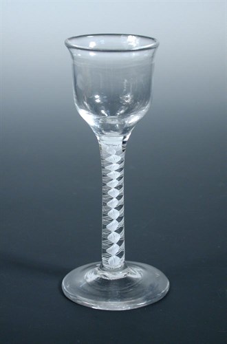 Lot 65 - An 18th century opaque twist wine glass