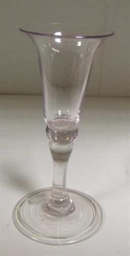 Lot 96 - An 18th century baluster gin glass
