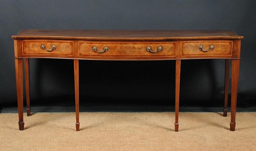 Lot 853 - A George III revival serpentine mahogany serving table, 20th century