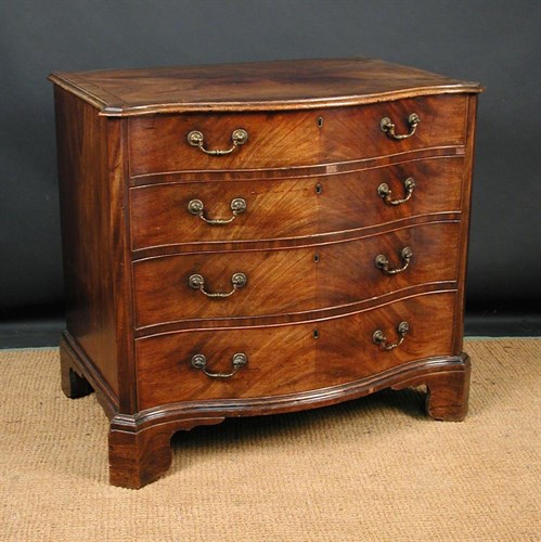 Lot 840 - A George III mahogany serpentine chest of drawers, circa 1770