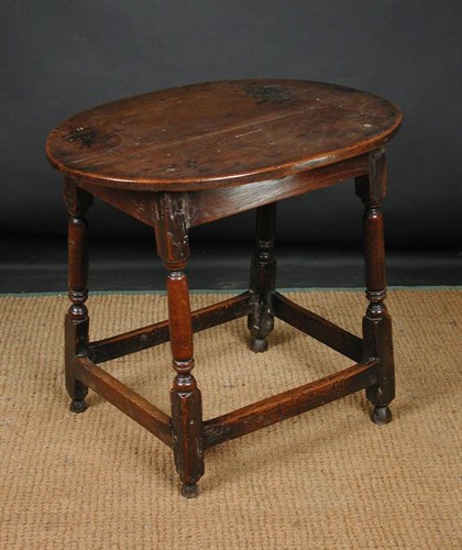 Lot 844 - An 18th century oak oval joint table