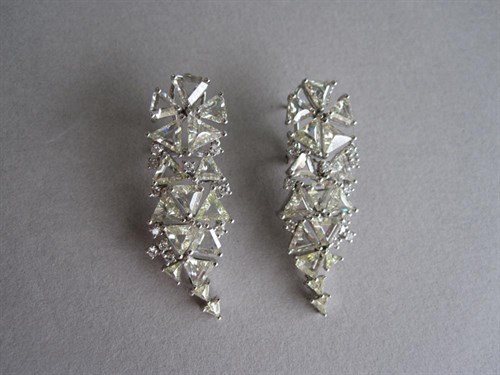 Lot 224 - A pair of diamond encrusted earpendants