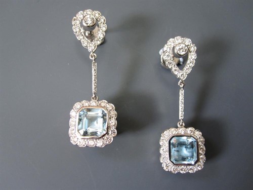 Lot 206 - A pair of diamond and blue topaz earpendants