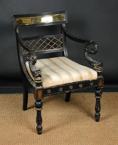 Lot 868 - A Regency ebonised elbow dining chair in the manner of Thomas Hope
