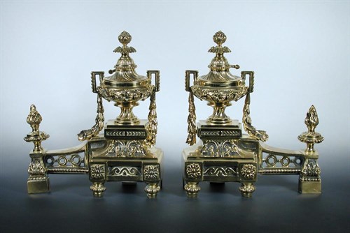Lot 862 - A pair of polished brass chenets